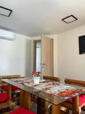 a dining room with a table and some chairs at Secret Paradise apartment in Zgornje Gorje