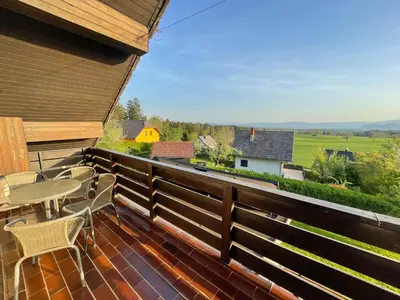 a balcony with a table and chairs and a view at Apartment Zupan in Preddvor