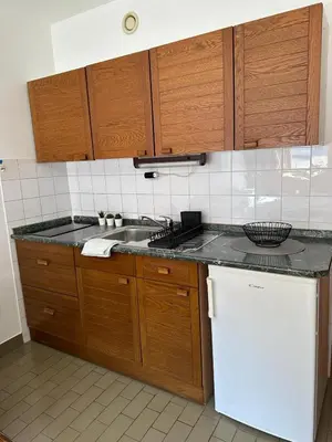 a kitchen with a sink and a counter top at App Bovec in Bovec