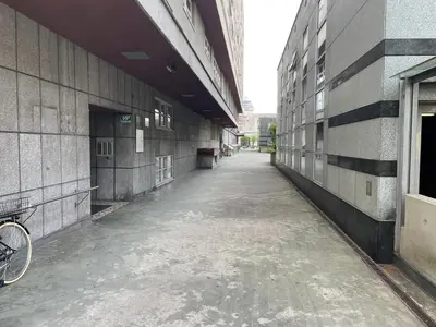 an empty alley between two buildings with a bike parked on the side at Apartment KOZOLEC - best central location in Ljubljana