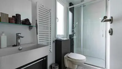 a bathroom with a toilet and a sink and a shower at Nord mobile house in Velenje