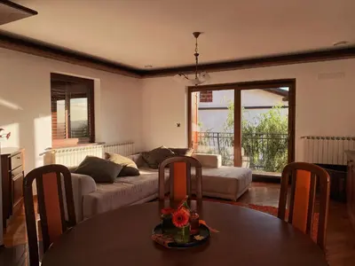 a living room with a couch and a table at Apartma Domačija Bole in Sežana