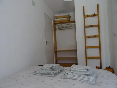 a bedroom with a bed with folded towels on it at Apartment Josephine in Tolmin