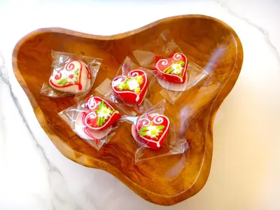 a group of heart shaped cookies on a wooden plate at Apartment 14 Luna in Bovec