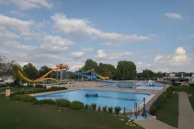 a large pool with a water park with slides at Brunarica Dolce Vita 85 in Brežice