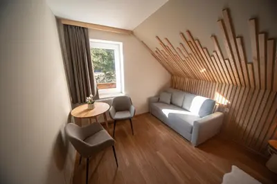a living room with a couch and a table at Turizem na kmetiji Rdečnik in Slovenj Gradec