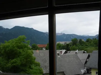 a view of mountains from a window at Apartments Cesar in Bohinj
