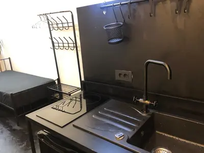 a kitchen counter with a sink and a sink at INDUSTRIAL ZONE-STUDIO 3 in Ljubljana