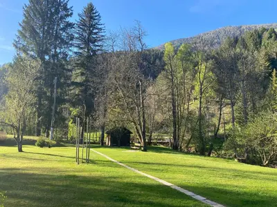 a park with a path in the middle of a field at Apartment Lucka, Kranjska Gora in Kranjska Gora