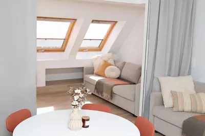 a living room with a couch and a table at Apartment Lucka, Kranjska Gora in Kranjska Gora