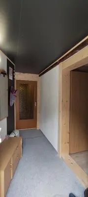 an empty room with a closet and a door at Domačija Markc in Železniki