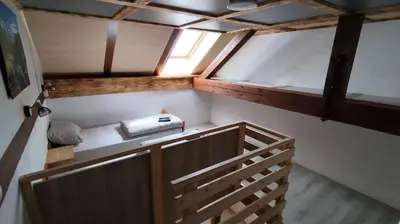 an overhead view of a small room with a wooden staircase at Domačija Markc in Železniki