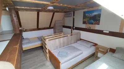 an overhead view of a room with two bunk beds at Domačija Markc in Železniki