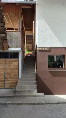 a stairway leading up to a building with a stair case at Domačija Markc in Železniki