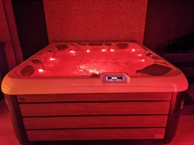 a red tub with lights on top of it at Spa Hera in Šmartno pri Litiji