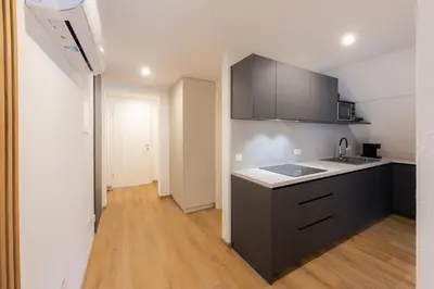 a kitchen with a sink and a counter top at Apartments BB in Bohinj