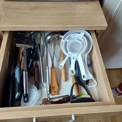 a wooden drawer filled with lots of kitchen utensils at Brunarica 30 Terme Čatež in Mostec