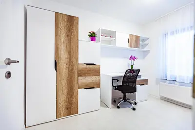 an office with a mirror and a desk and a chair at Cute tiny house in Ljubljana