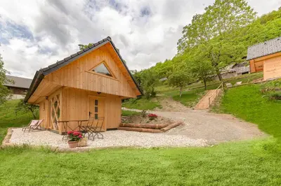 a small wooden house with a pathway leading to it at Pr' Končovc in Kranj