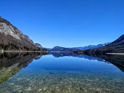 a view of a lake with mountains in the background at Počitniška hiša Ukanc in Bohinj