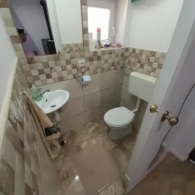 a bathroom with a toilet and a sink at Apartma Lavanda in Dramlje