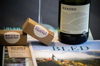 a bottle of wine sitting next to a bottle of wine at Bled Center modern apartment with big balcony in Bled