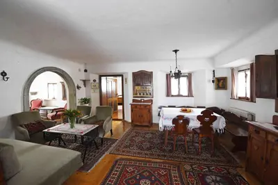 a living room with a couch and a table at Resort Vidmar - Baroque villa near Bled in Lesce