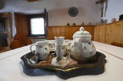 a tray with a tea pot and cups on a table at Resort Vidmar - Baroque villa near Bled in Lesce