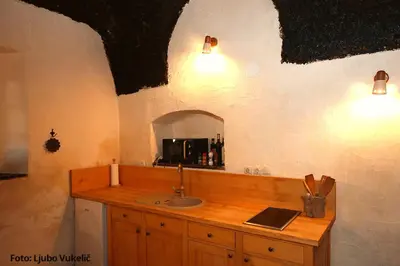 a bathroom with a sink and a mirror at Dormouse House in Slovenia in Grahovo