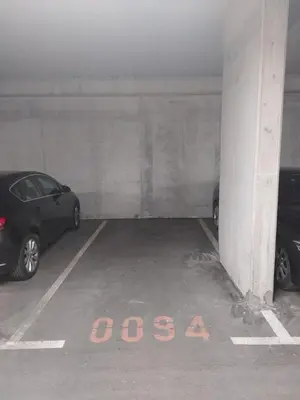 two cars parked in a parking garage with the word osaa at MERY Studio in Ljubljana