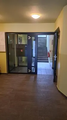 an entrance to an office building with glass doors at MERY Studio in Ljubljana