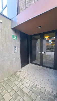 an entrance to a building with a sign on it at MERY Studio in Ljubljana
