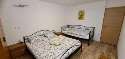 two twin beds in a room with at Apartma pri Klari in Kočevje