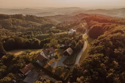 an aerial view of a house in the middle of a forest at Sweet Retreat in Trebelno