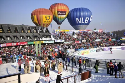 a group of hot air balloons flying over a crowd of people at Apartments Bogdanovic in Maribor