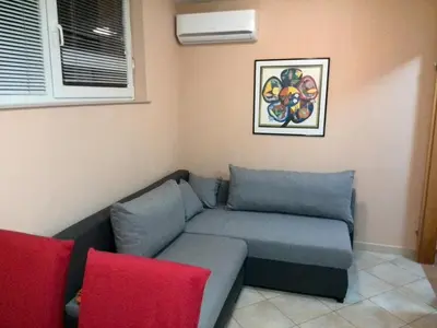 a couch in a corner of a room at Apartments Bogdanovic in Maribor