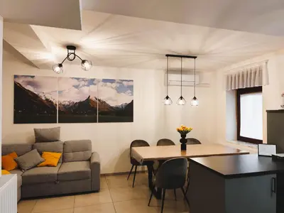 a living room with a couch and a table at Apartment Irena Bovec in Bovec