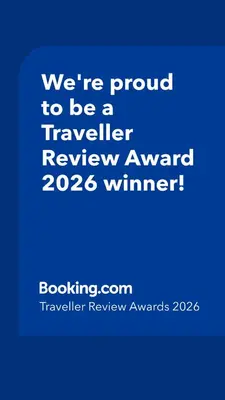 a blue sign that says were proud to be a traveller reviewagency winner at ArtRock Studio in Radovljica