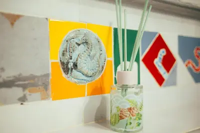 a glass vase sitting on a table next to a wall at ArtRock Studio in Radovljica
