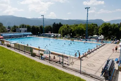 a large swimming pool with people in it at ArtRock Studio in Radovljica