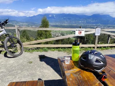 a table with a helmet and a bike on it at ArtRock Studio in Radovljica