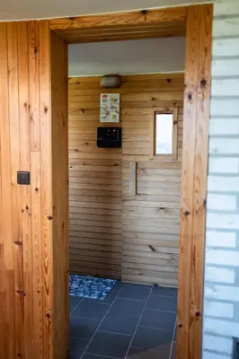 a room with a sauna with wooden walls at Hiška Gmajna in Slovenj Gradec