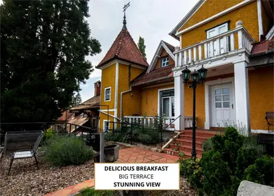 a yellow house with a sign in front of it at Herga Wine Estate - Old lady - Holiday Home in Ivanjkovci