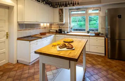 a kitchen with a table with fruit on it at Herga Wine Estate - Old lady - Holiday Home in Ivanjkovci