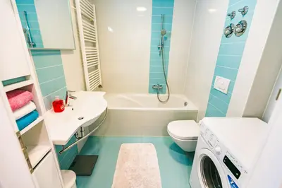 a bathroom with a sink and a toilet and a tub at Cute Tiny Flat in Ljubljana