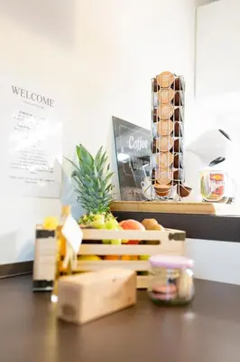 a table with a bunch of food on it at Cute Tiny Flat in Ljubljana