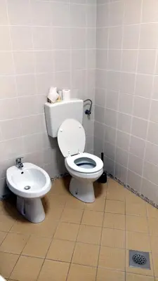 a bathroom with a toilet and a bidet at Bright&Spaceus Apartment with View in Nova Gorica