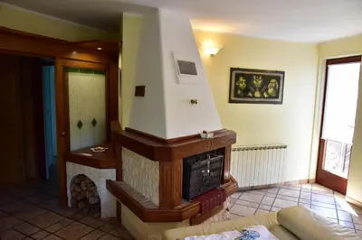 a living room with a fireplace in a room at Apartment JANG in Tolmin