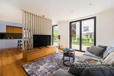 a living room with a couch and a flat screen tv at Vila Nina Bohinj in Bohinj