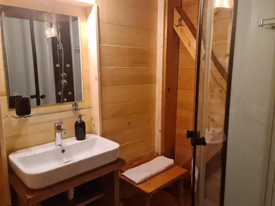 a bathroom with a sink and a shower at Apartments Anž'k in Bled